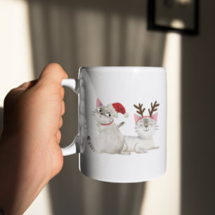 Niedliche Weihnachtskatzenkatze Weihnachtsmannmüt Kaffeetasse
