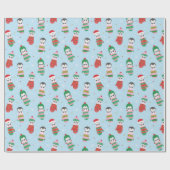 Niedliche Weihnachtspinguine in Fingern in hellbla Geschenkpapier (Flach)