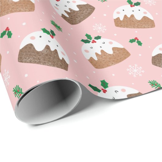 Niedliche Weihnachtspudding auf hellrosa Geschenkpapier (Rolleneckpunkt)