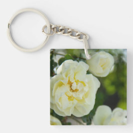 Niedliche Weißrosen für positive Schlüsselanhänger