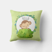 Niedlicher Affe, der aus Hinter Bush herausholt Kissen (Rückseite)