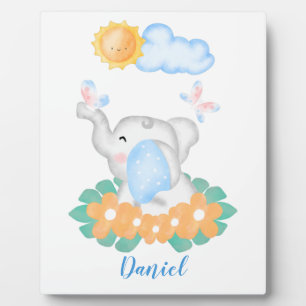 Niedlicher Baby Elephant mit orangefarbenen Blume Fotoplatte