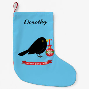 Niedlicher Blackbird mit einem Weihnachtsball-Indi Kleiner Weihnachtsstrumpf