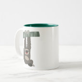 Niedlicher Cartoon-Schlamm, der von einer Tasse au (Vorderseite Links)