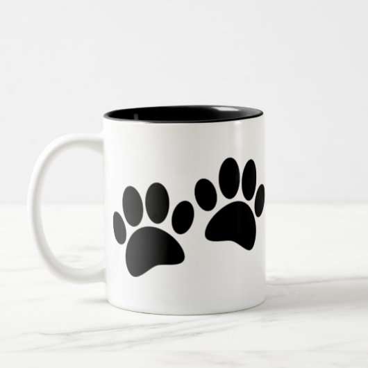 Niedlicher Cartoon Schwarze Welpe Paw Prints Zweifarbige Tasse (Links)