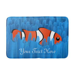 Niedlicher Clownfisch und schöner Anemon des Blaue Badematte