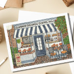 Niedlicher Coffee House Store Postkarte<br><div class="desc">Senden Sie jemandem eine besondere Notiz mit dieser saisonalen Postkarte des Coffee Shops mit einem originalen Aquarellbild eines malerischen Cafés und Cafés! Das Coffee House Common Grounds serviert zum ersten Mal in der Saison Kürbisspitzbücher und frisch zubereitetes Gebäck. Eine ruhige Szene, dieses Herbst-Schaufenster hat gerade eröffnet, und die Chipmunks genießen...</div>