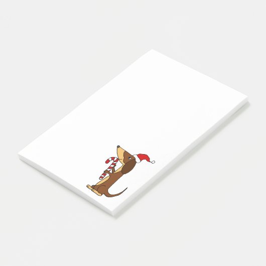 Niedlicher Dackel-Hund im Post-it Klebezettel (angewinkelt)