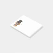 Niedlicher extravaganter Welpe mit Monocle und Post-it Klebezettel (angewinkelt)