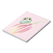 Niedlicher Frosch auf rosa Notizblock (Rotiert)