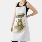 Niedlicher Frosch mit einem Regenschirm am See Schürze (InSitu)