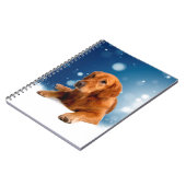 Niedlicher Golden Retriever Hund sitzt in Schneest Notizblock (Linke Seite)