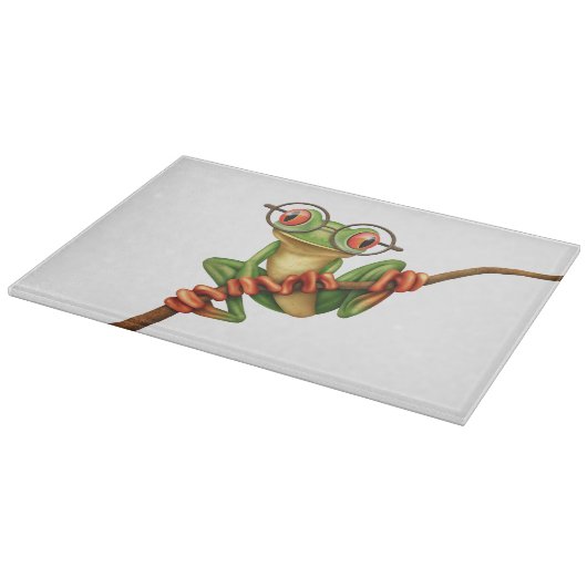 Niedlicher grüner Baum-Frosch mit Augen-Gläsern Schneidebrett (Ecke)