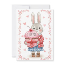 Niedlicher Hase hält rosa Cupcake