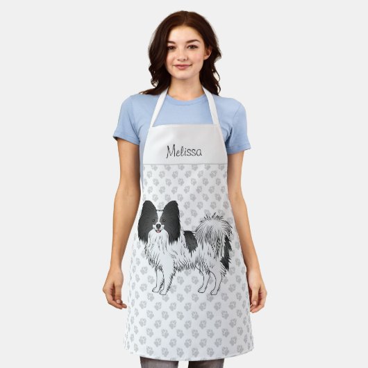 Niedlicher Hund aus schwarz-weißem Papillon mit be Schürze (Getragen)