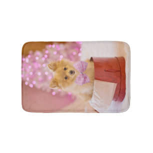 Niedlicher Hund mit Pink Bow Weihnachtsfoto Badematte