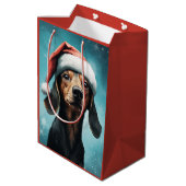 Niedlicher Hund Weihnachtsmannmütze Dackel Weihnac Mittlere Geschenktüte (Rückseite Schrägansicht)