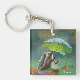 Niedlicher Igel mit einem Blattschirm Schlüsselanhänger