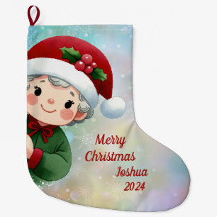 Niedlicher Junge mit Weihnachtsmannmütze Großer Weihnachtsstrumpf