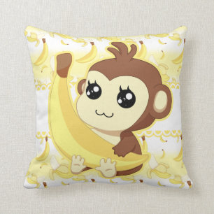 Niedlicher Kawaii Affe, der Banane hält Kissen