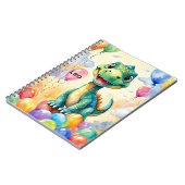 Niedlicher kleiner Dinosaurier mit viel farbenfroh Notizblock (Linke Seite)