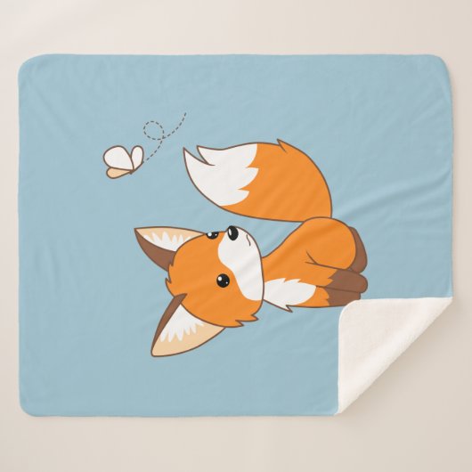 Niedlicher kleiner Fuchs sieht Schmetterling auf b Sherpadecke (Vorderseite (Horizontal))