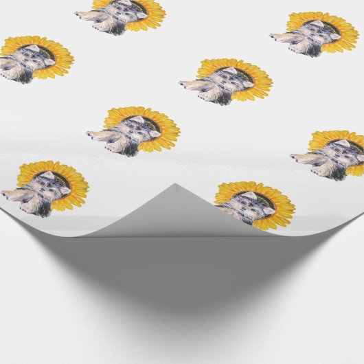Niedlicher kleiner Yorkshire-Welpenhund und Sonnen Geschenkpapier (Ecke)