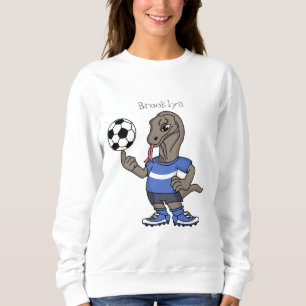 Niedlicher Komodo-Drache beim Fußballspielen Carto Sweatshirt