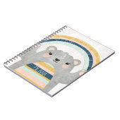 Niedlicher magischer Bär mit farbenfroher Regenbog Notizblock (Linke Seite)