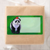 Niedlicher Panda-Bär in Weihnachtsmannmütze auf Gr (Insitu)