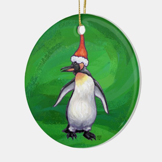 Niedlicher Pinguin in Weihnachtsmannmütze auf Gree Keramikornament (Links)