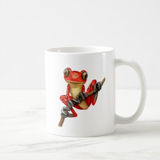 Niedlicher roter Baum-Frosch auf einer Kaffeetasse (Rechts)