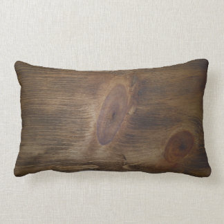 Niedlicher rötlich brauner rustikaler hölzerner lendenkissen