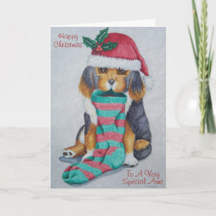 niedlicher, schwarz-brauner Welpe mit Weihnachtswe Feiertagskarte
