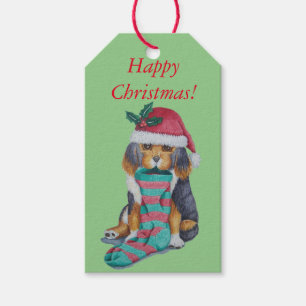 niedlicher, schwarz-brauner Welpe mit Weihnachtswe Geschenkanhänger