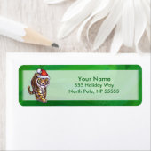 Niedlicher Tiger in der Weihnachtsmannmütze über g (Insitu)