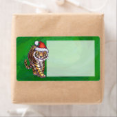 Niedlicher Tiger in der Weihnachtsmannmütze über g (Insitu)