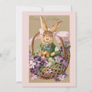 Niedlicher vintage Osterhase im Korb mit Veilchen Feiertagskarte