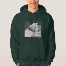 Niedlicher weißer Welpenhund mit grünem Scarf