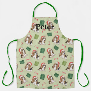 Niedlicher Welpe mit seiner Weihnachtsmannmütze-Sc Schürze