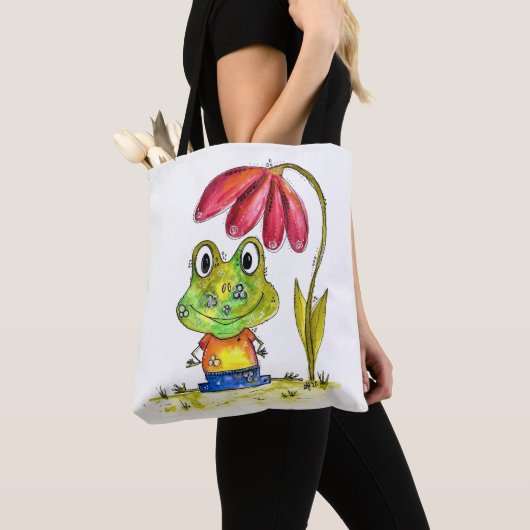 Niedlicher Whimsical Green Frosch unter einer rote Tasche (Von Nahem)