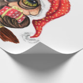 Niedliches Babyschale in Weihnachtshut und Geschen Geschenkpapier (Ecke)