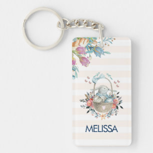 Niedliches Bunny in einem Korb mit Eiern und Hübsc Schlüsselanhänger