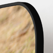 Niedliches Eichhörnchen isst ein Nussbaum-Foto Pickleball Schläger (Linke Seite)