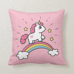 Niedliches Einhorn auf einem Regenbogendesign Kissen