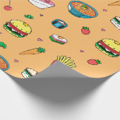 Niedliches, farbiges Lebensmittelmuster auf Orange Geschenkpapier (Ecke)