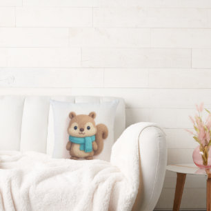 Niedliches Felt-Eichhörnchen mit einem gemütlichen Kissen