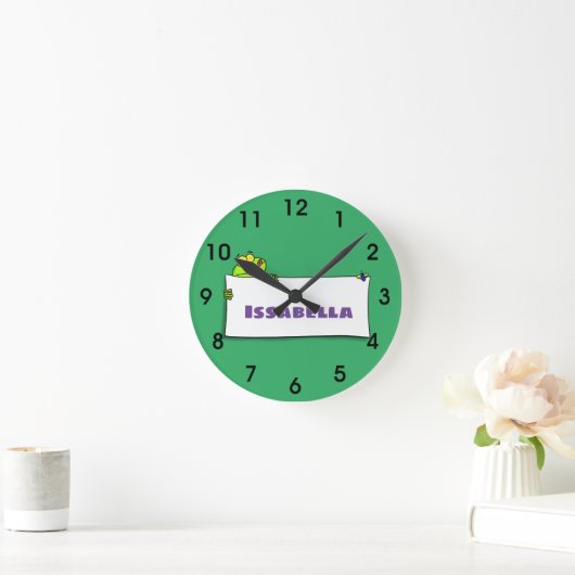 Niedliches Grünfrostschild Cartoon Illustration Runde Wanduhr (Zuhause)