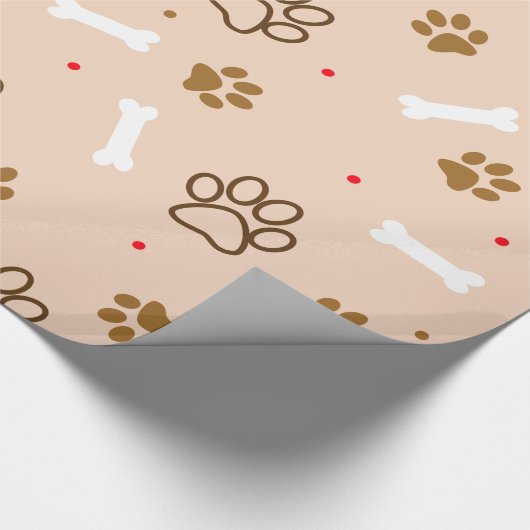 Niedliches Hundemuster mit den Tatzen entbeint Geschenkpapier (Ecke)