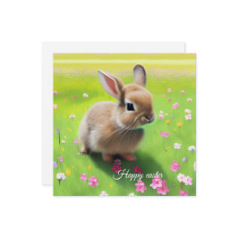 Niedliches Kaninchen auf einer Blume-Wiese